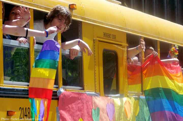 School bus with rainbow flags