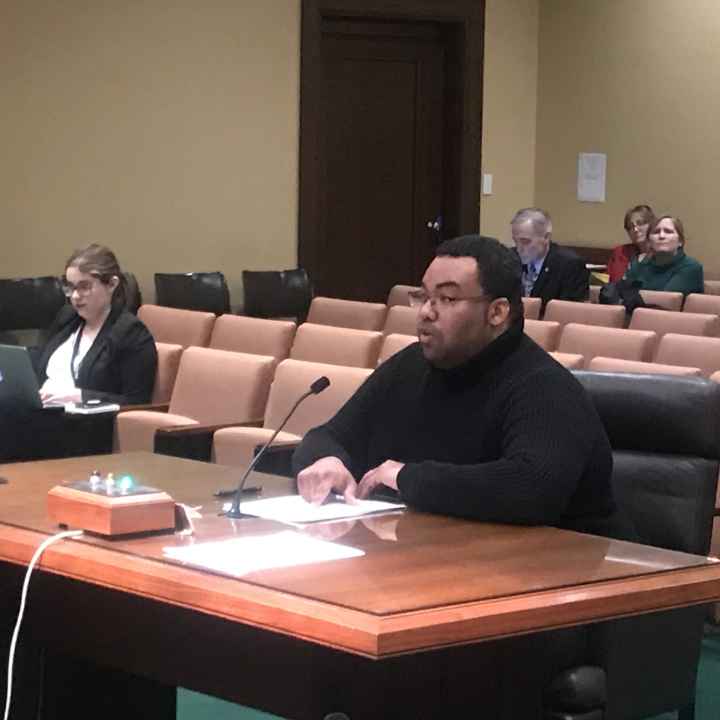 Andrew Aleman testifies at a committee hearing.