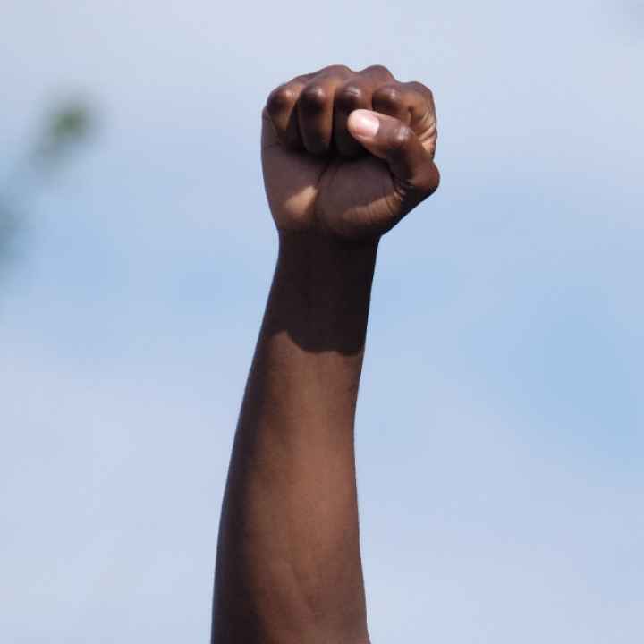 A man holds a fist in the air during a Nebraska protest following the killing of George Floyd.