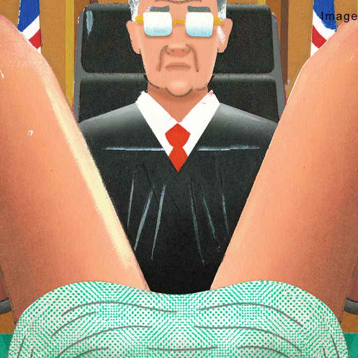 Image of a judge looking between a woman&#039;s legs.