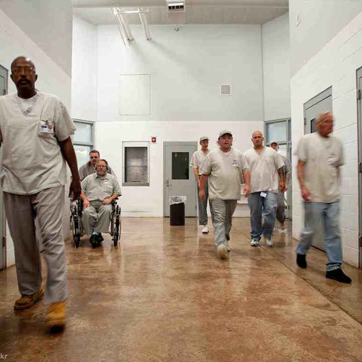 Photo of prisoners in a hallway